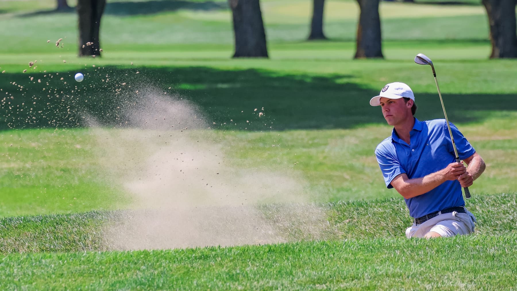 Michael Springer hitting a bunker shot at the Illinois State Amateur